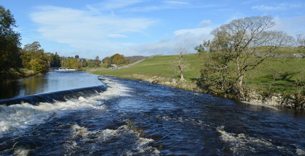 The weir systems of the River Wharfe at Grassington that once help feed water to the mills Circular walk through Grass Wood and River Wharfe from Grassington, Wharfedale, North Yorkshire Dales National Park, England