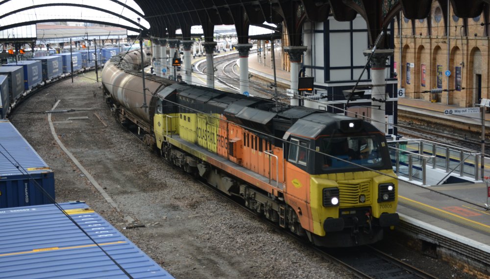 Colas operated Class 70/8 diesel locomotive 70805 passing by Platform 5 of York Station with the 0855 Lindsay oil refinery to Jarrow Prax  oil tanks train (January 2023)
