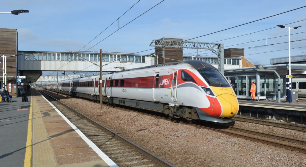 trainspotting a Class 800 LNER/Azuma service from Kings Cross, London, to Inverness heading north through Peterborough Station (trainspotting February 2023) trainspotting Peterborough station