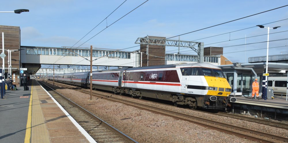 Trainspotting the rear DVT 82214 of a Class 91 electric locomotive hauled  LNER service from Kings Cross, London to Leeds, heading north through Peterborough station (February 2023). trainspotting Peterborough station