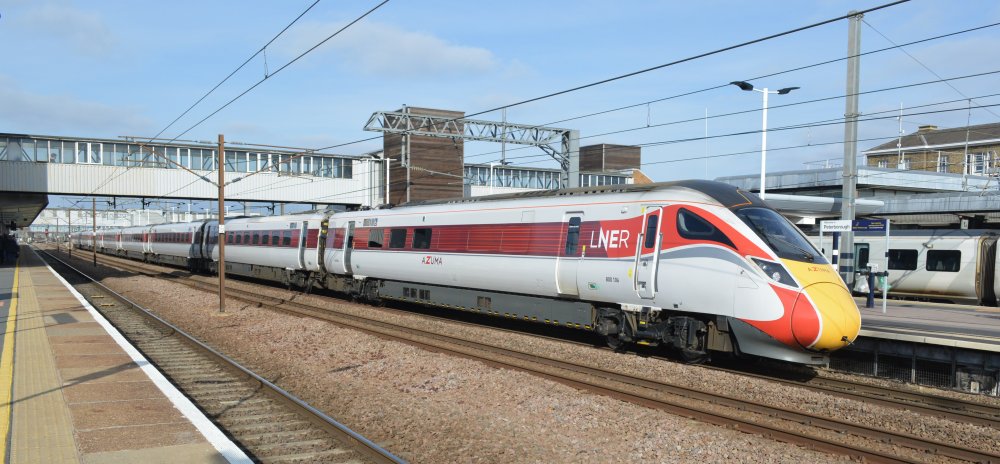 The rear of bi-mode Class 800 800106 LNER/Azuma service from Kings Cross, London, to Edinburgh heading north through Peterborough Station (February 2023)
 trainspotting Peterborough station