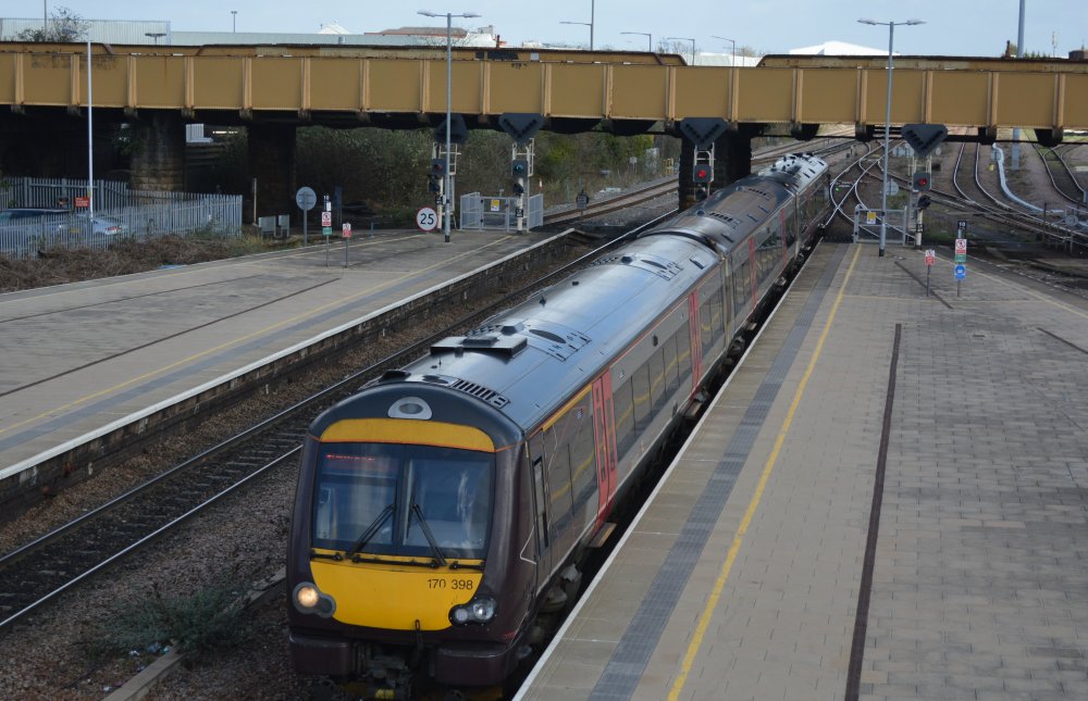 Class 170 DMU unit entering Leicester station with an East Midlands Railway service from Stansted to Birmingham (trainspotting Leicester March 2023)