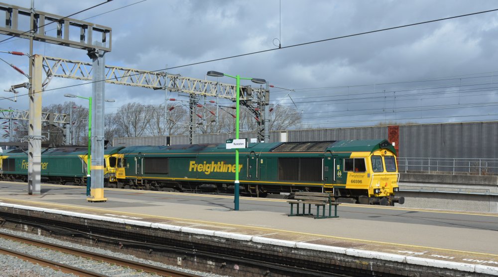 Trainspotting A pair of Freightliner Class 66 diesel freight locomotives head south through Nuneaton station with a Crewe Basford Hall S.S.M to Southampton MCT intermodal freight train (March 2023).