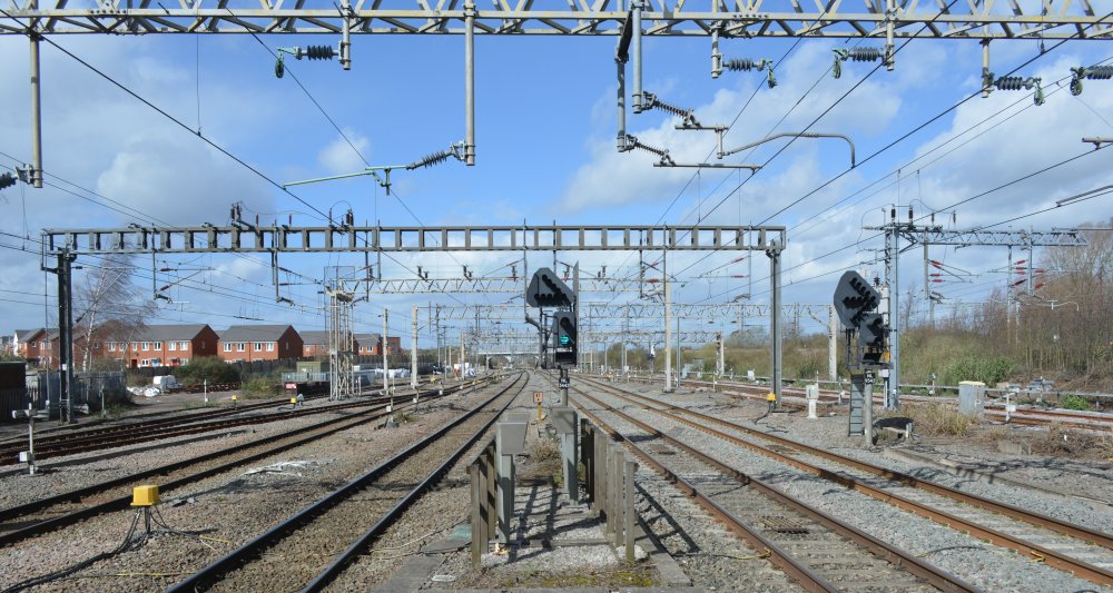 A general view of the railway tracks and gantries looking north from Nuneaton station, a good trainspot and photographic location.