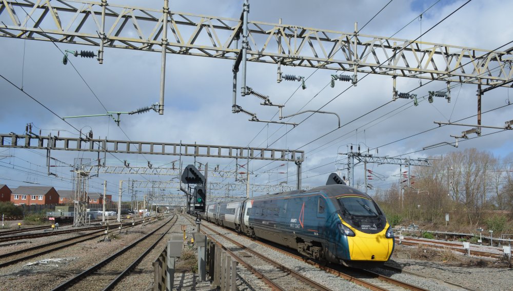 A Class 390 EMU racing through Nuneaton station with an Avanti West Coast train service from Liverpool to Euston (trainspotting March 2023)