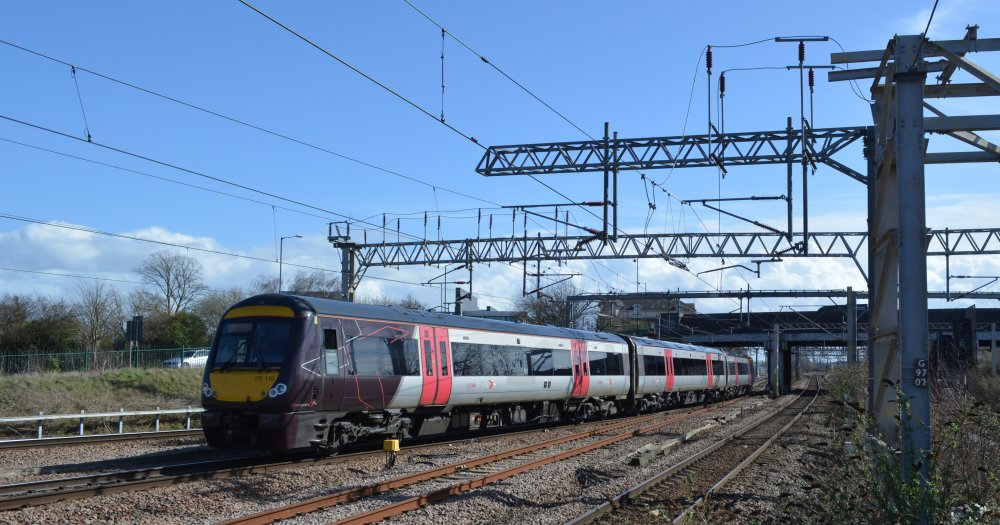 A view south-west from Nuneaton station as a Class 170 DMU unit train enters Nuneaton station with a CrossCountry service from Stansted Airport to Birmingham New Street station (trainspotting March 2023). The line to west Leicester curves round to the left.