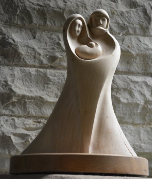 Modern sculpture of a couple and child in the Church of St Mary and St John, Hardraw. Circular walk from Hawes to Hardraw Force