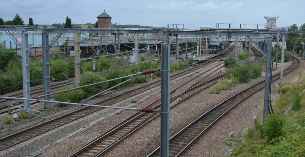 Looking north up the tracks from south of Nuneaton station, the West Coast down and up mainlines on the left, on the right the tracks from the Leicester line into platforms 6 and 7 (Trainspotting July 2023).