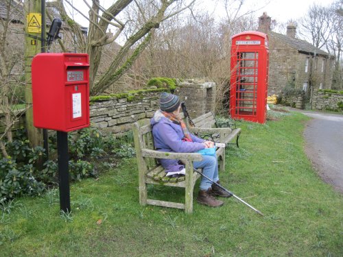 village centre of West Scrafton with its red post box and red telephone box. Circular walk from Carlton in Coverdale