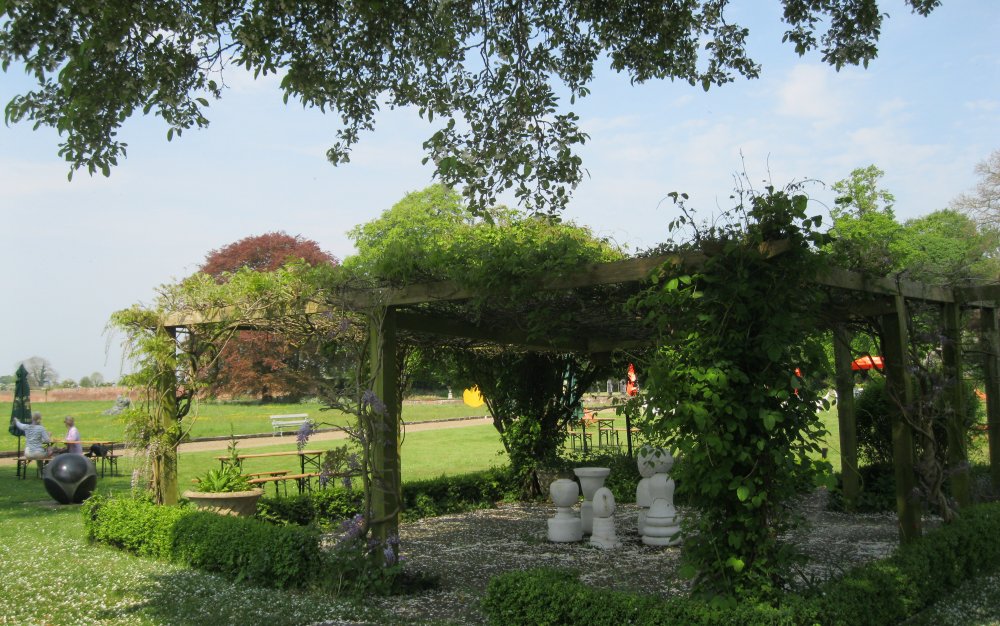 Shaded gardens 'picnic' area Thirsk Hall Sculpture Garden, North Yorkshire, England