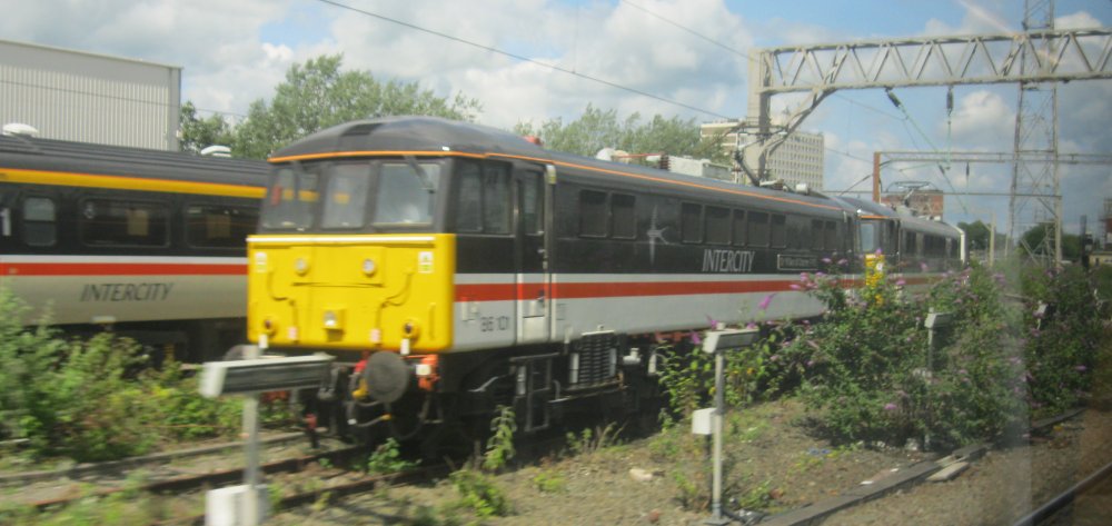 Class 86 electric locomotive 86101 E3191 Sir William A Stanier FRS at Crewe, InterCity Swallow Livery (May 2024)