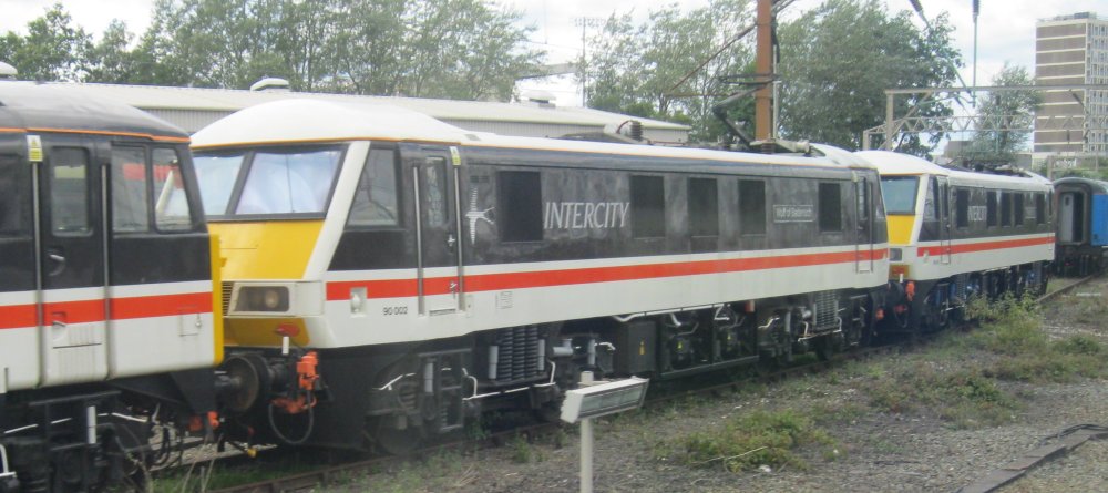 Class 90 electric locomotive 90002 Wolf of Badenoch, British Rail InterCity Swallow livery (Crewe, May 2024)