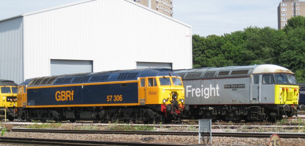 In blue and yellow livery, GBRf Class 57 diesel locomotive 57306 in the yard of UK rail Leasing, Leicester, 2024