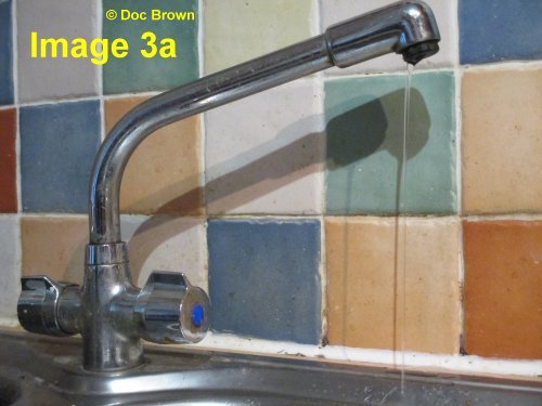 deflecting a stream of water with a charged plastic rod of static electricity